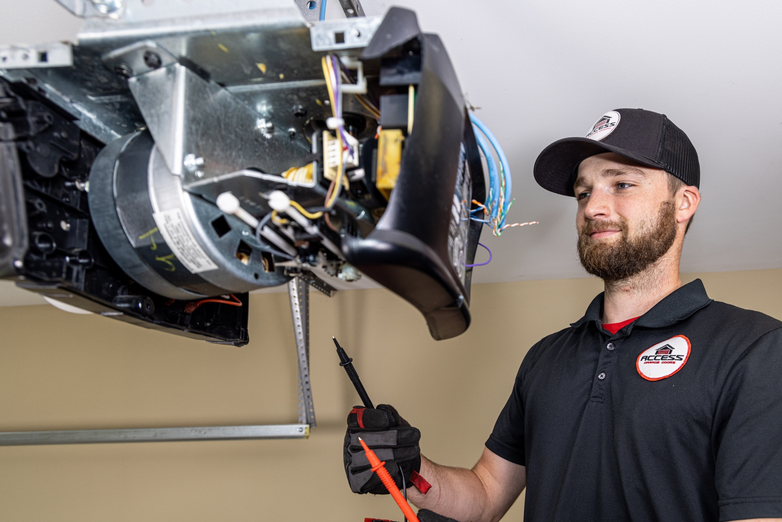 Garage door specialist working on the motor.