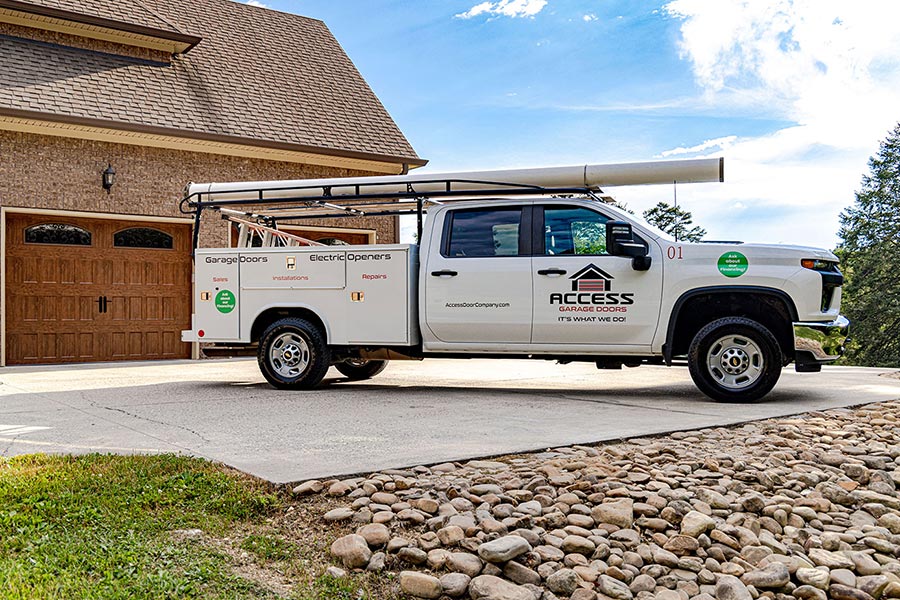 Access Garage Doors truck outside a residential home