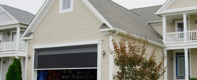 A house with a garage door screen