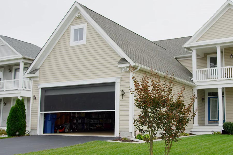 A house with a garage door screen