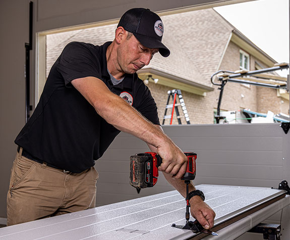garage-door-service Access Garage Doors technician working on a garage door