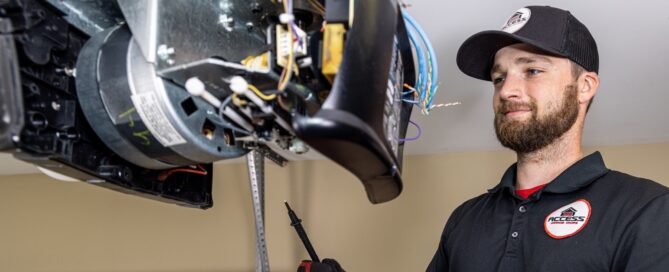 Garage door specialist working on the motor.