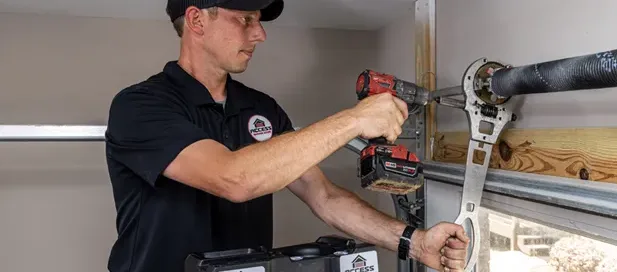 Access Garage Doors employee repairing a garage door