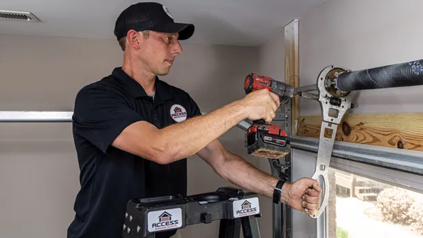 Access Garage Doors employee repairing a garage door