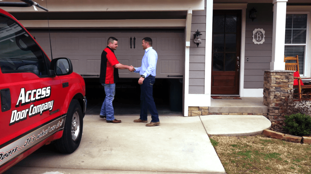 Bradfordville customer meeting with garage door specialist after installation