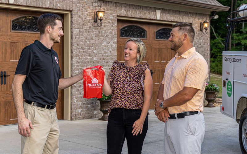 Customers in Midway talking to a garage door specialist.