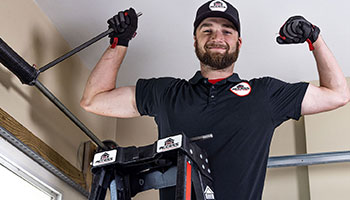 Access Garage Door technician repairing garage door